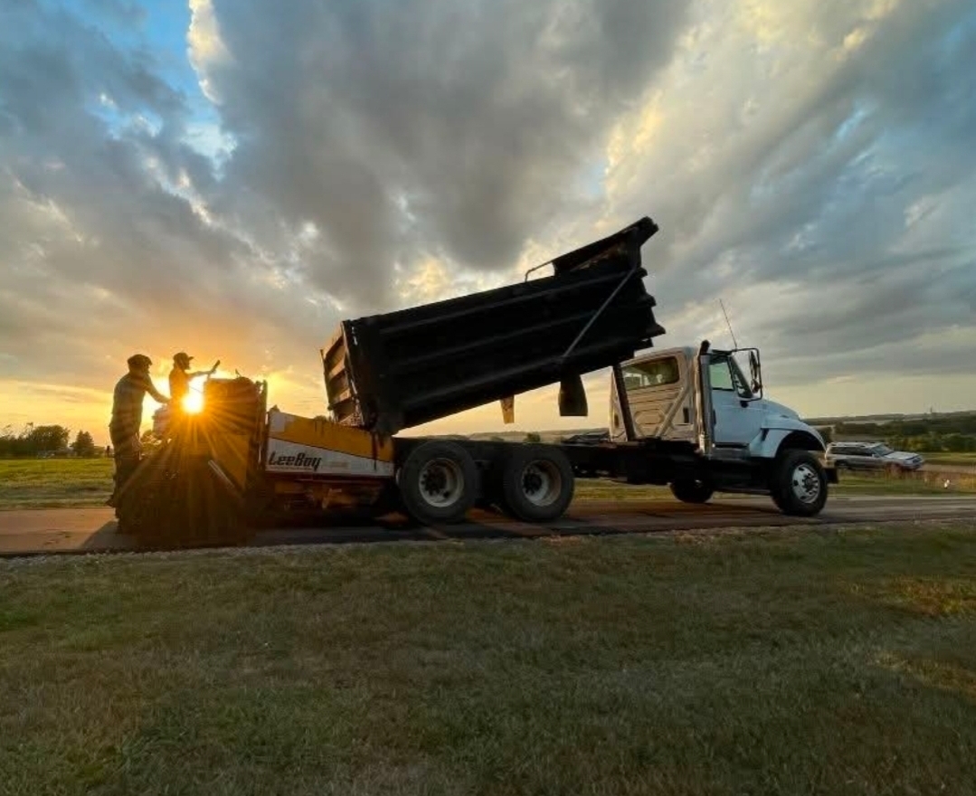 Team repairing a pothole in a road