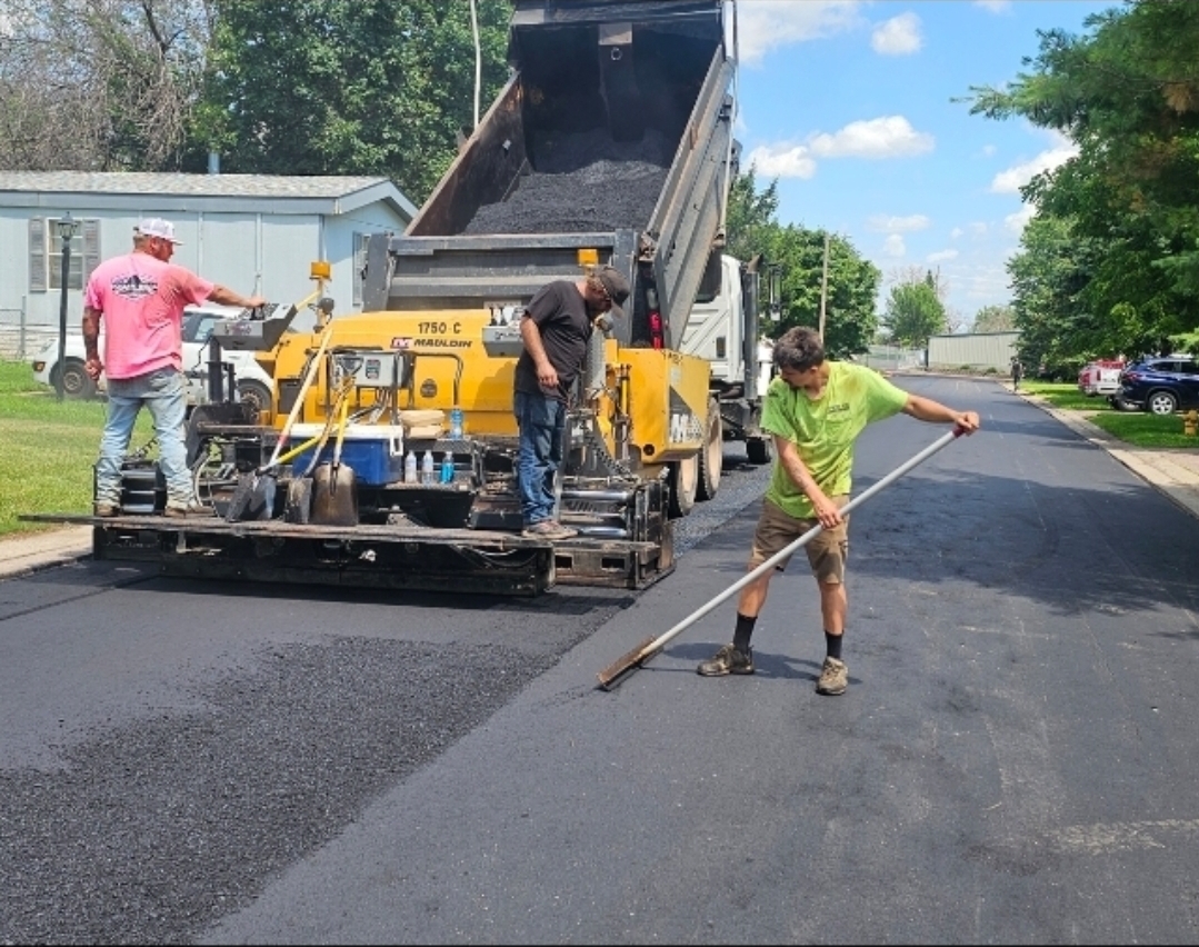 Finished seamless asphalt patch on a driveway